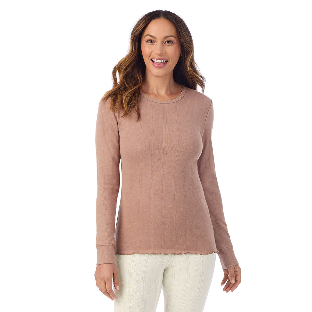 A lady is wearing Cotton Pointelle Long Sleeve Crew
