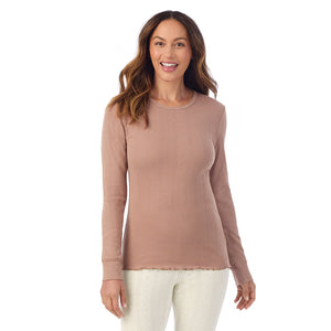 A lady is wearing Cotton Pointelle Long Sleeve Crew
