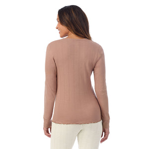 A lady is wearing Cotton Pointelle Long Sleeve Crew
