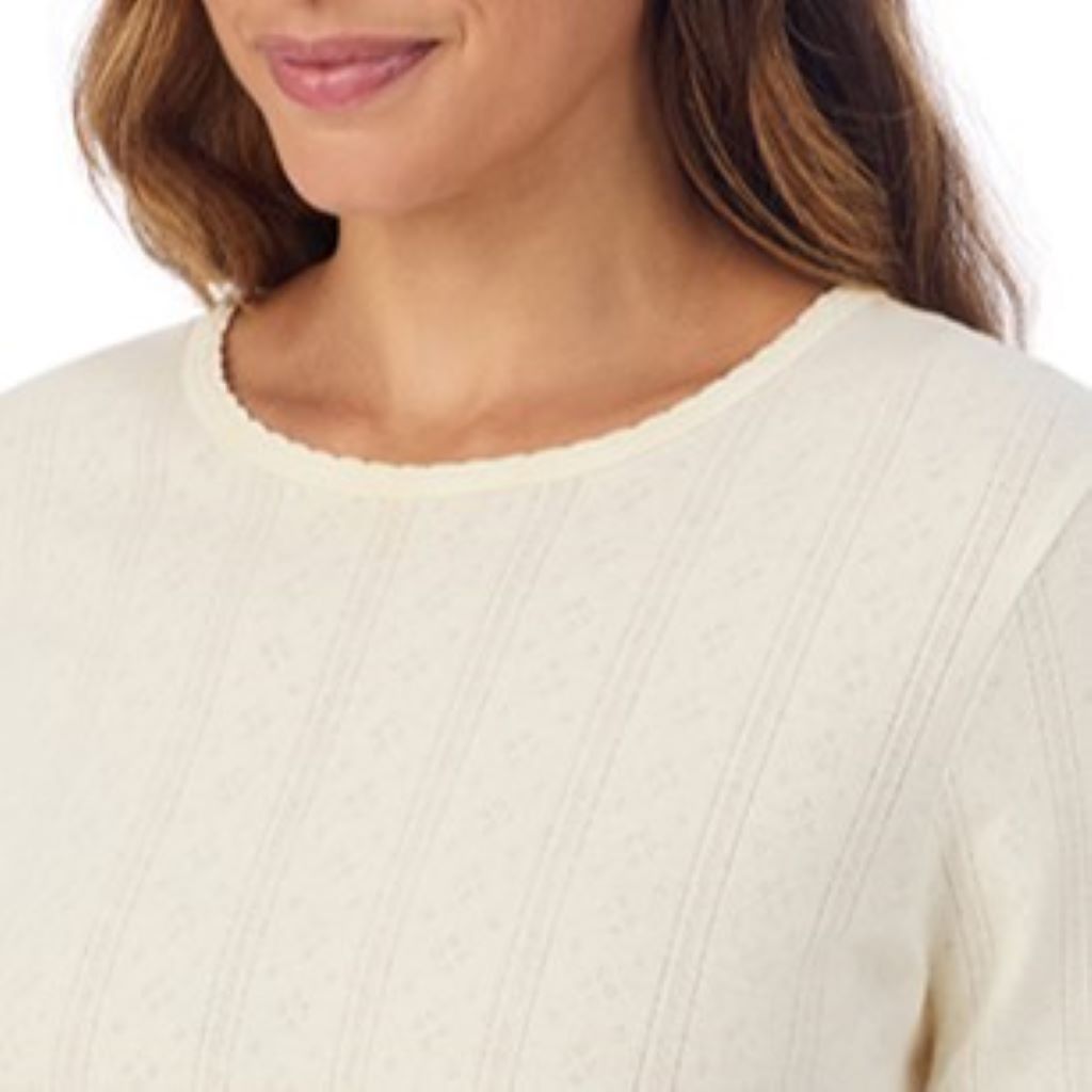 A lady is wearing Cotton Pointelle Long Sleeve Crew
