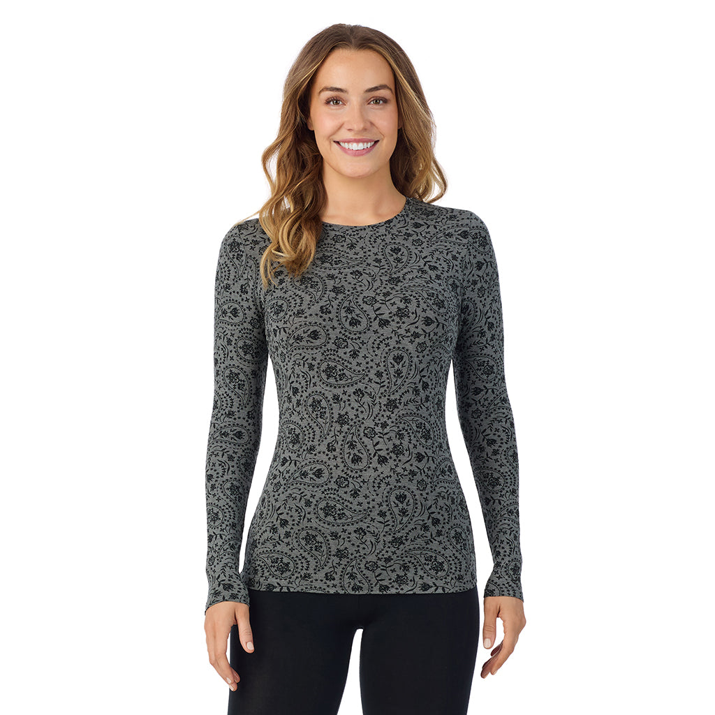 A lady wearing a charcoal paisley long sleeve stretch crew.