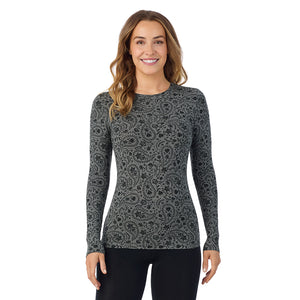 A lady wearing a charcoal paisley long sleeve stretch crew.