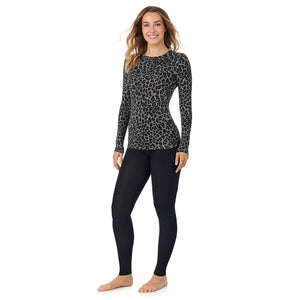 A lady wearing a charcoal leopard long sleeve stretch crew.