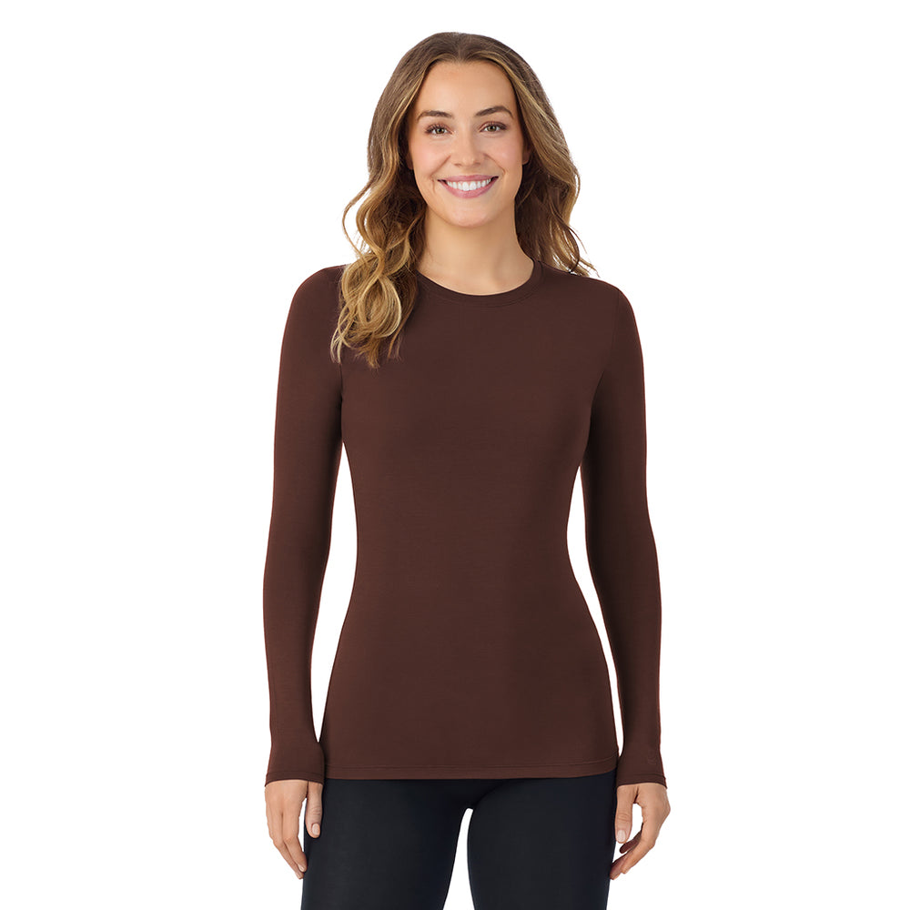 A lady wearing a deep mahogany long sleeve stretch crew.