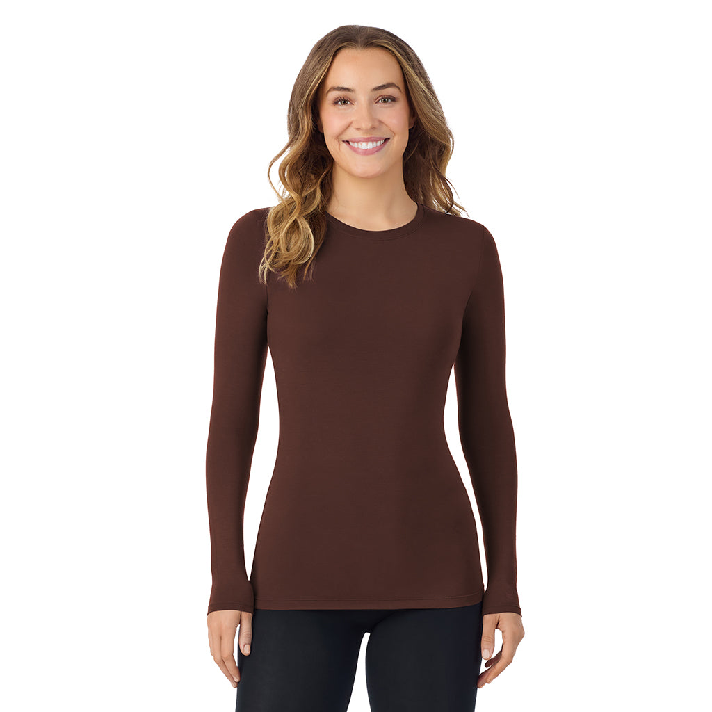 A lady wearing a deep mahogany long sleeve stretch crew.