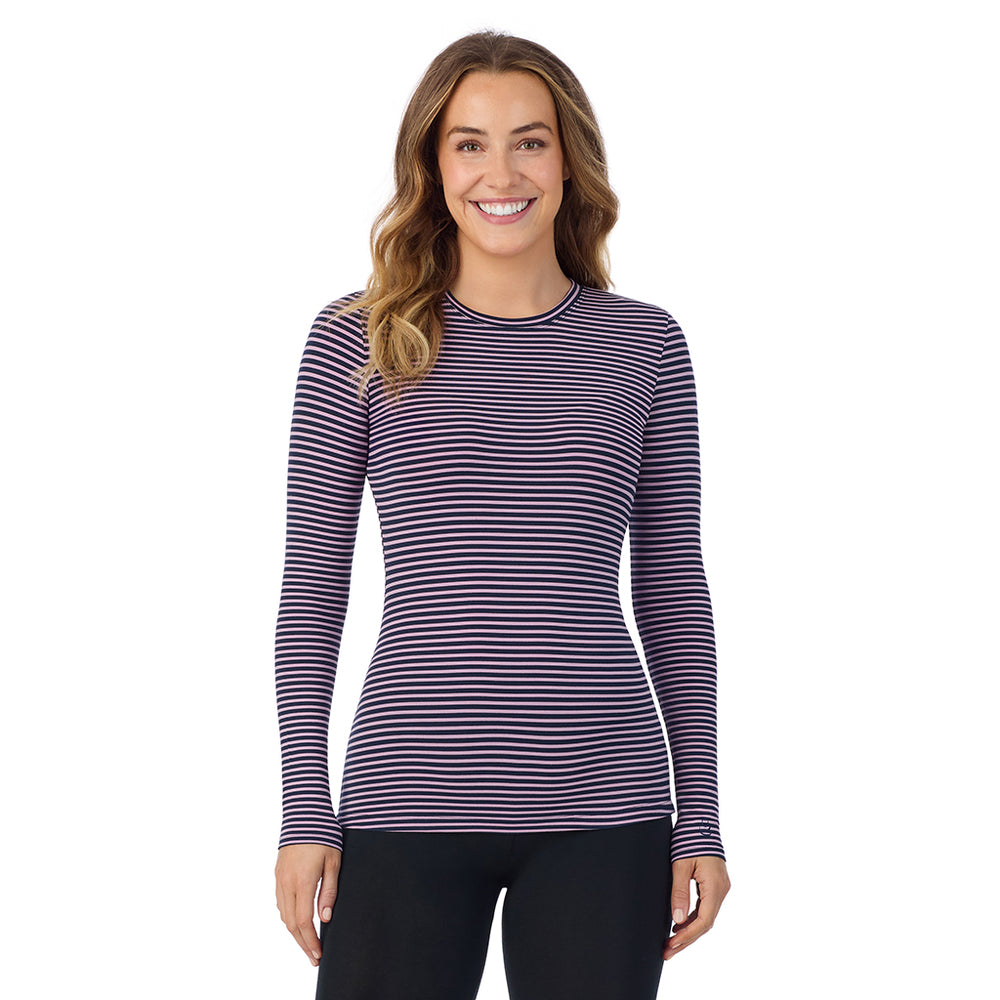 A lady wearing a mauve/navy stripe long sleeve stretch crew.