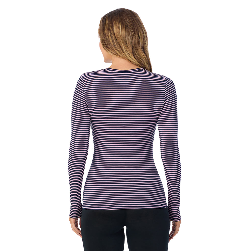 A lady wearing a mauve/navy stripe long sleeve stretch crew.