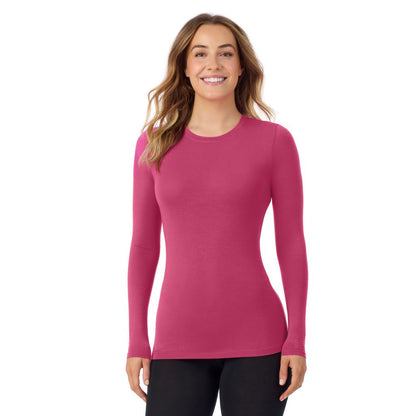 Very Berry; Model is wearing size S. She is 5'11.5", Bust 34", Waist 26", Hips 37". @A lady wearing a very berry long sleeve stretch crew.