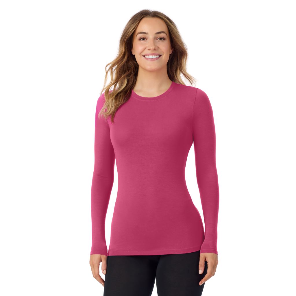 A lady wearing a very berry long sleeve stretch crew.