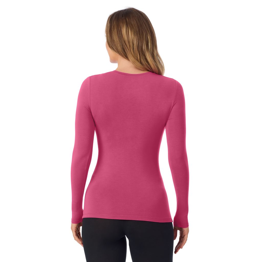 A lady wearing a very berry long sleeve stretch crew.