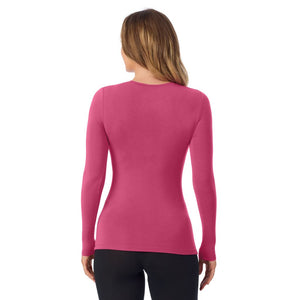 A lady wearing a very berry long sleeve stretch crew.