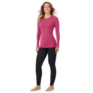 A lady wearing a very berry long sleeve stretch crew.