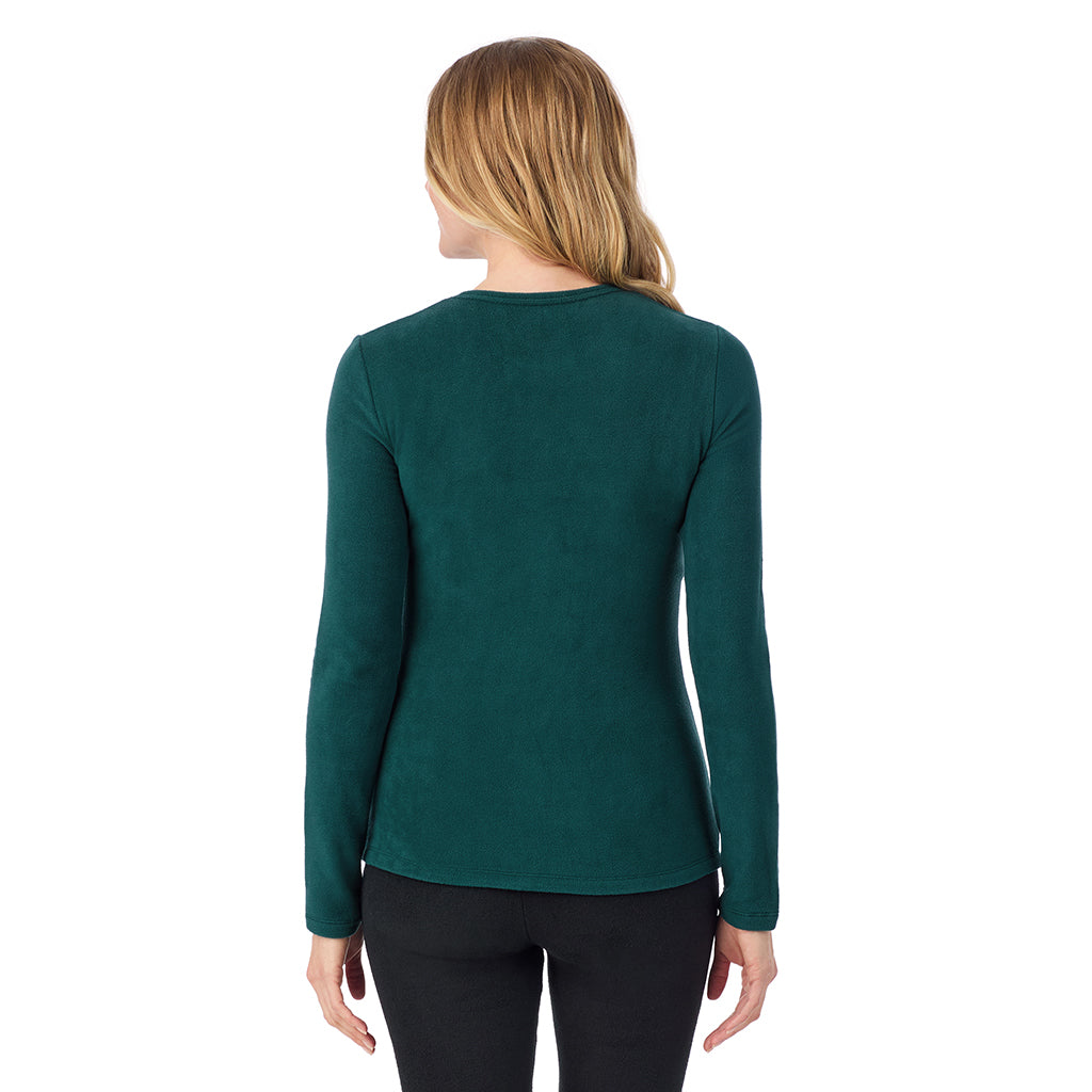 A lady wearing Dark Pine long sleeve crew