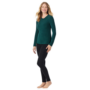 A lady wearing Dark Pine long sleeve crew