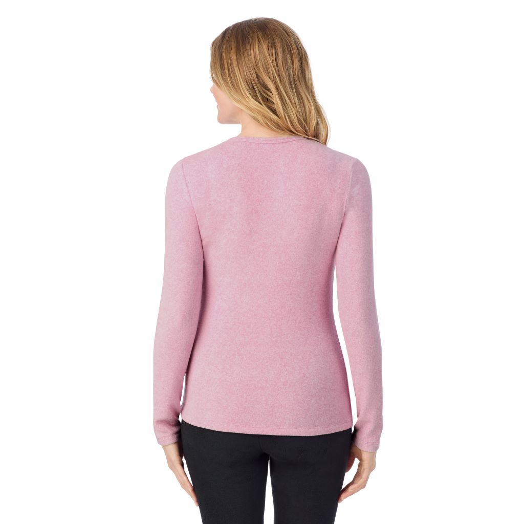 A lady wearing Mauve Mist Heather long sleeve crew