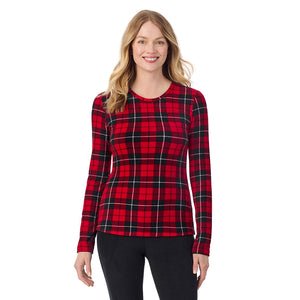 A lady wearing Red/ Black Tartan long sleeve crew