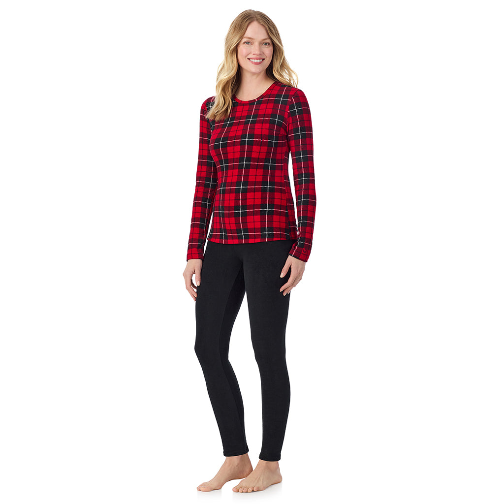A lady wearing Red/ Black Tartan long sleeve crew