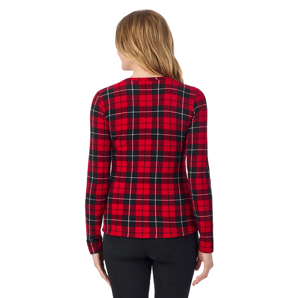 A lady wearing Red/ Black Tartan long sleeve crew