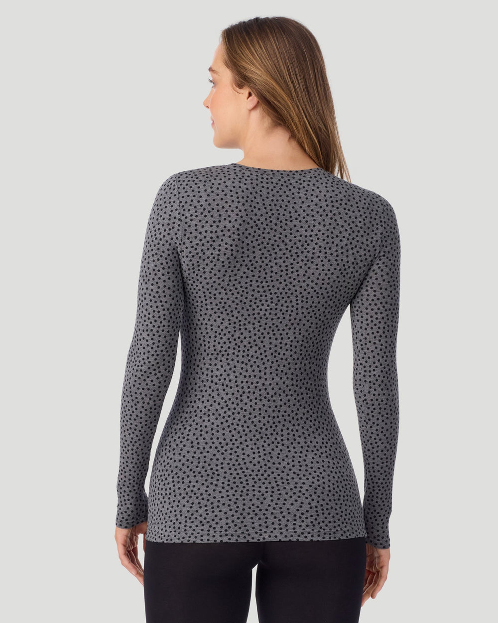 A lady wearing a Charcoal Polka Dot Plaid long sleeve stretch crew back look