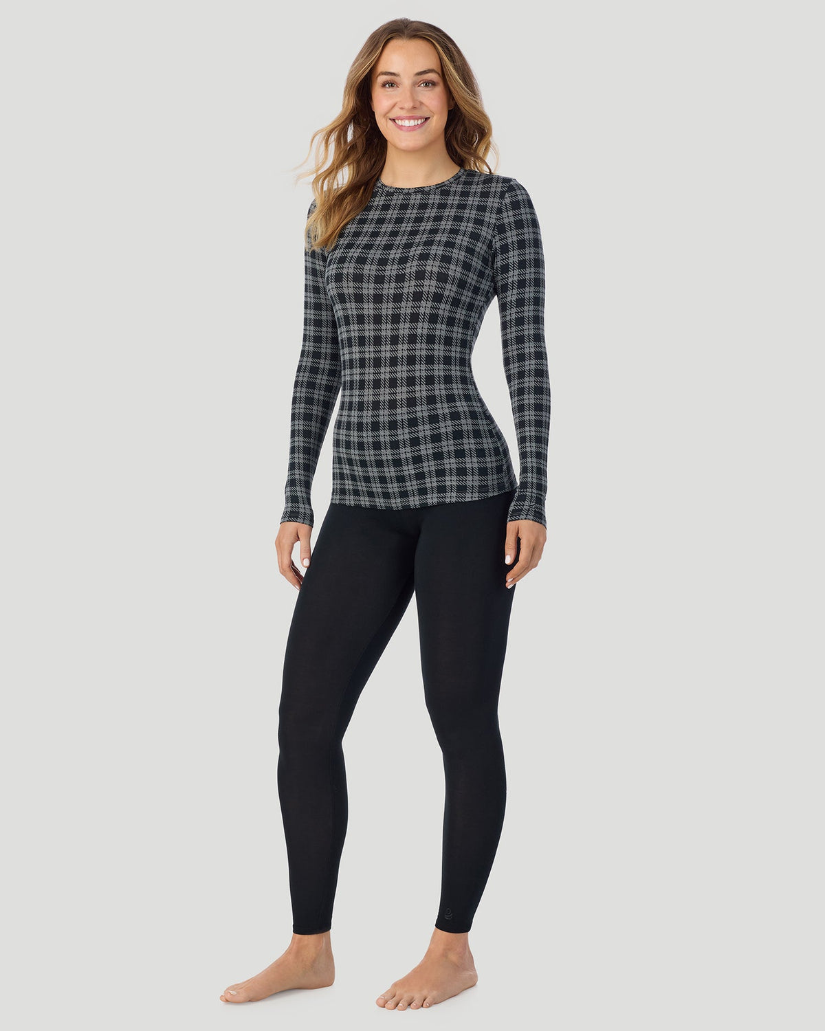 A lady wearing a Charcoal Tartan Plaid long sleeve stretch crew closer look