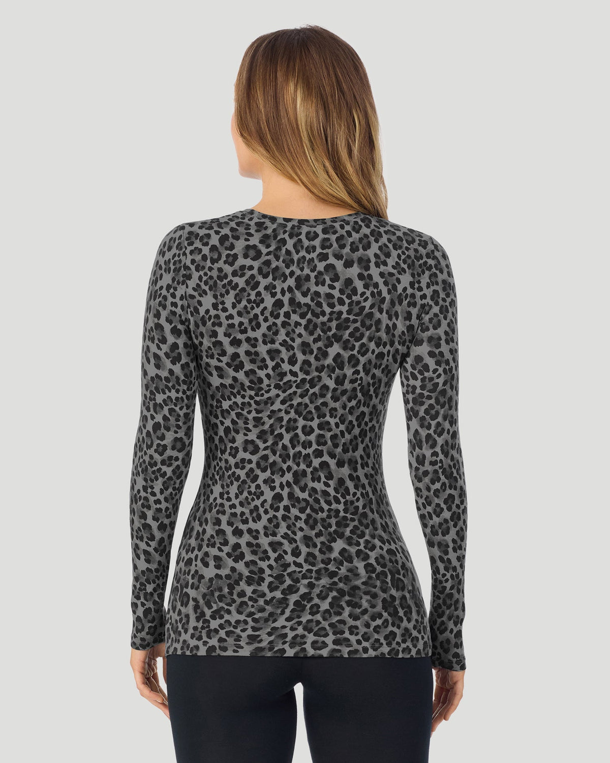 A lady wearing a Charcoal Leopard Plaid long sleeve stretch crew back look