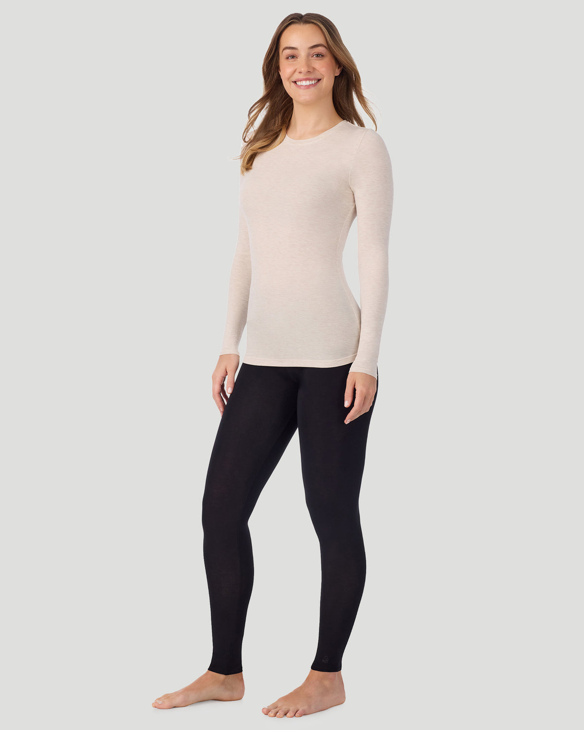 Oatmeal Heather; Model is wearing a size S. She is 5’11.5”, Bust 34”, Waist 27”, Hips 38.5”. @A lady wearing Softwear With Stretch Long Sleeve Crew PETITE in Oatmeal Heather in a front view standing pose