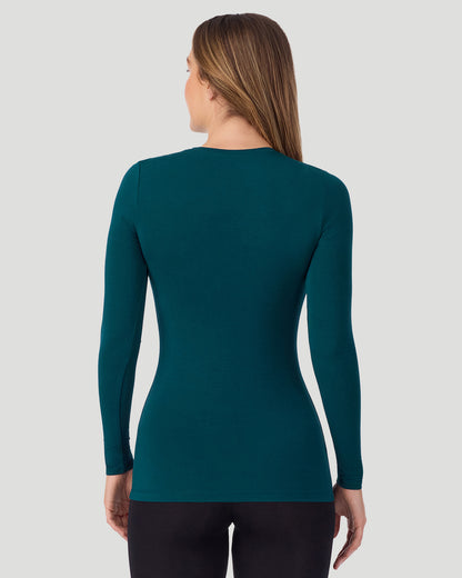 A lady wearing Softwear With Stretch Long Sleeve Crew TALL in Deep Emerald in a back view pose
