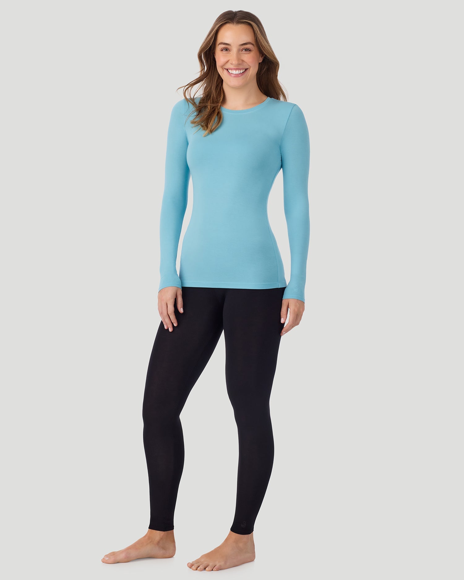 A lady wearing a Cadet Blue Plaid long sleeve stretch crew 