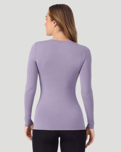 A lady wearing a Lilac Plaid long sleeve stretch crew back view