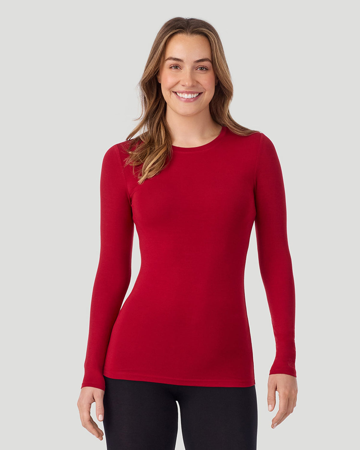 A lady wearing a Scarlet Plaid long sleeve stretch crew closer look