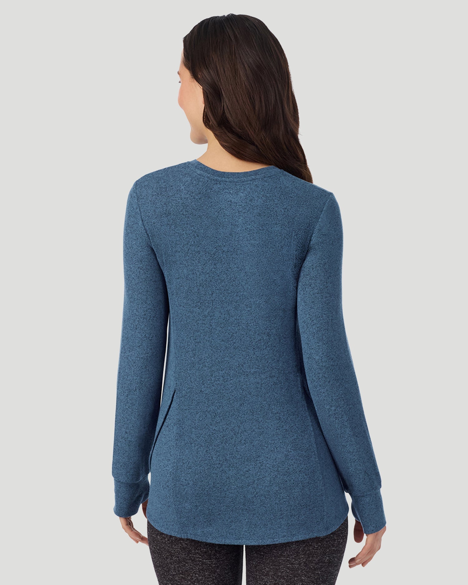  A Lady is wearing Deep Chambray SoftKnit Long Sleeve Crew in a back view closer look