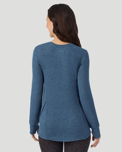  A Lady is wearing Deep Chambray SoftKnit Long Sleeve Crew in a back view closer look