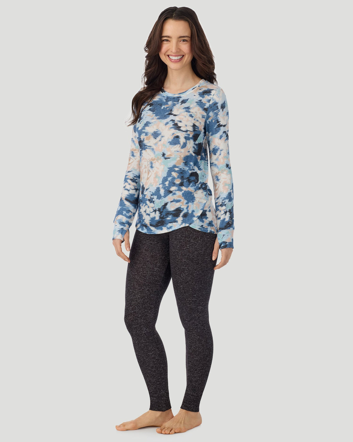 Blue Floral; Model is wearing a size S. She is 5’9.5”, Bust 34”, Waist 25”, Hips 36.5”. @ A Lady is wearing Blue Floral SoftKnit Long Sleeve Crew in a front view standing look