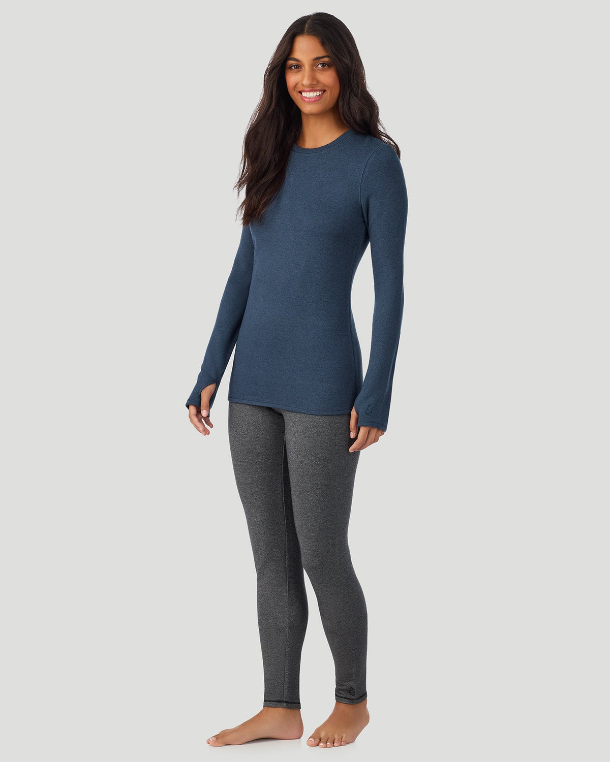 Deep Chambray; Model is wearing a size S. She is 5’7”, Bust 32”, Waist 25”, Hips 34”. @ A Lady is wearing Deep Chambray Ultra Cozy Long Sleeve Crew in a front view side angle pose