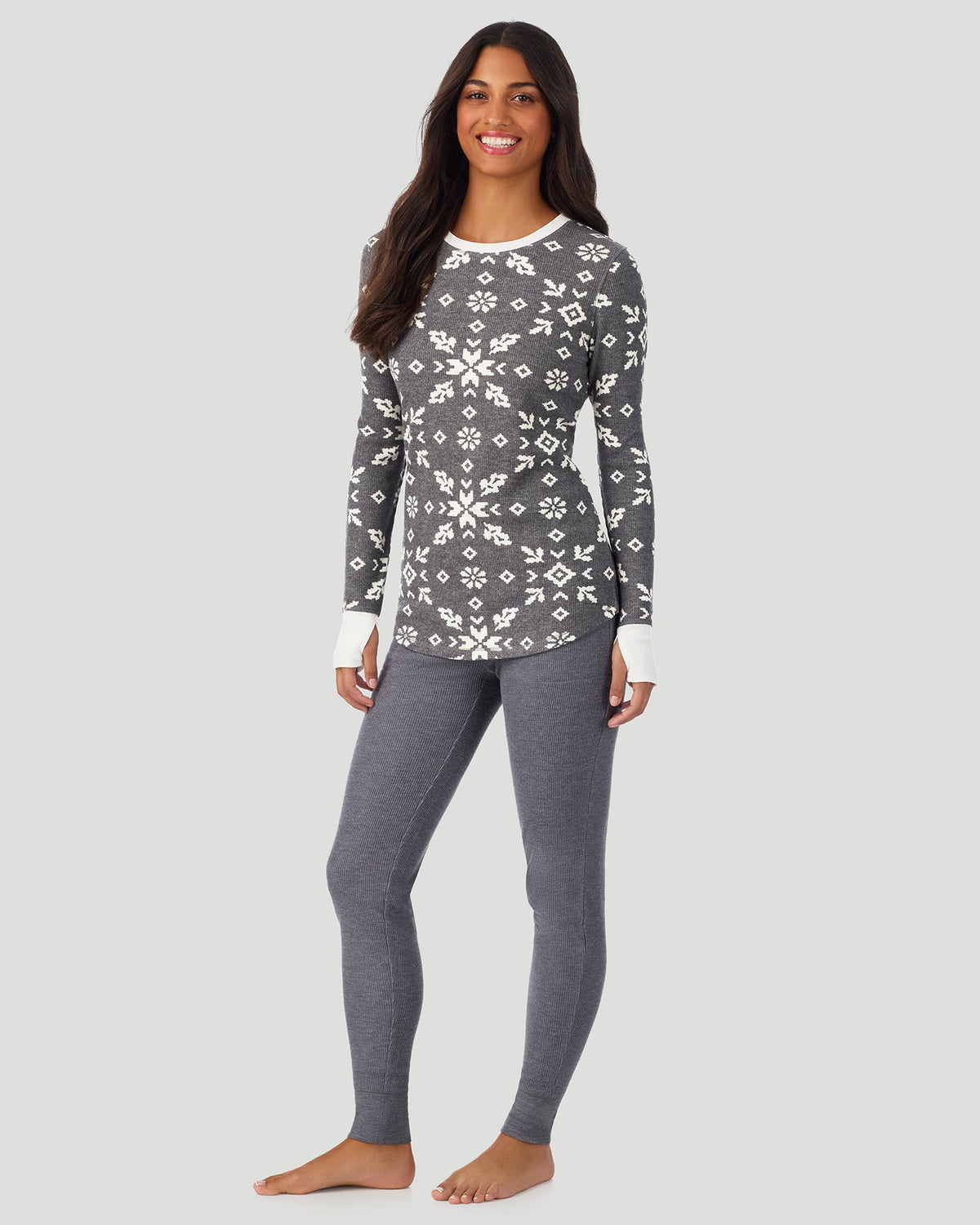 Stone Grey Winter Folk; Model is wearing a size S. She is 5’7”, Bust 32”, Waist 25”, Hips 34”. @A lady wearing Stone Grey Winter Folk Cozy Stretch Thermal Long Sleeve Crew in a front view standing pose