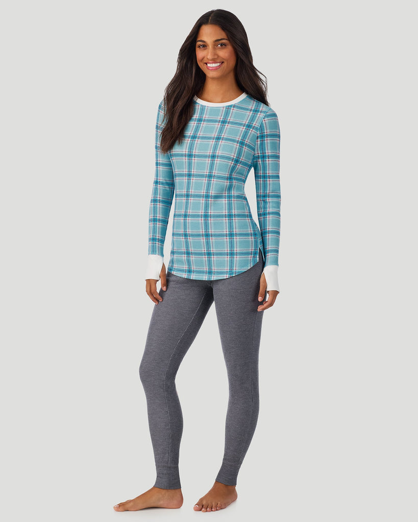 A lady wearing Cadet Blue Plaid Cozy Stretch Thermal Long Sleeve Crew in a front view standing pose