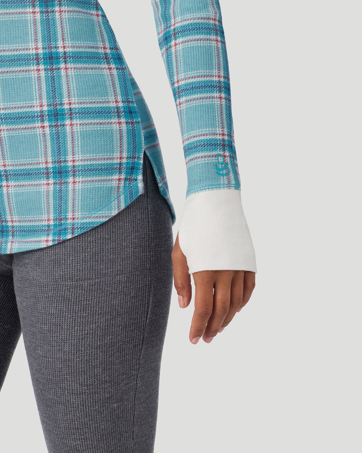 A lady wearing Cadet Blue Plaid Cozy Stretch Thermal Long Sleeve Crew in a front view detail close up look