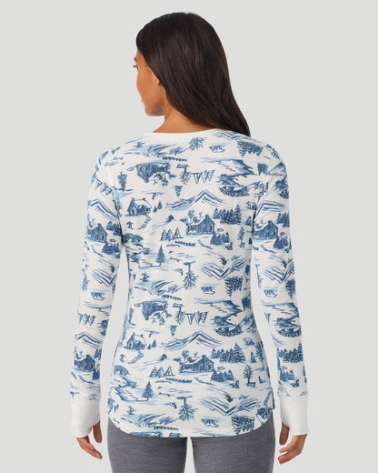 A lady wearing Blue Winter Toile Cozy Stretch Thermal Long Sleeve Crew in a back view pose