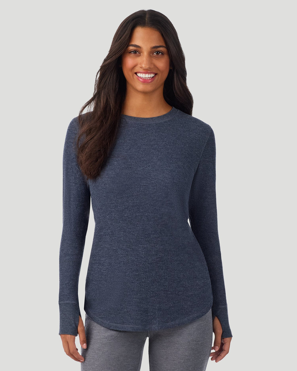 Medieval Blue Heather; Model is wearing a size S. She is 5’7”, Bust 32”, Waist 25”, Hips 34”. @A lady wearing Medieval Blue Heather Cozy Stretch Thermal Long Sleeve Crew in a front view pose