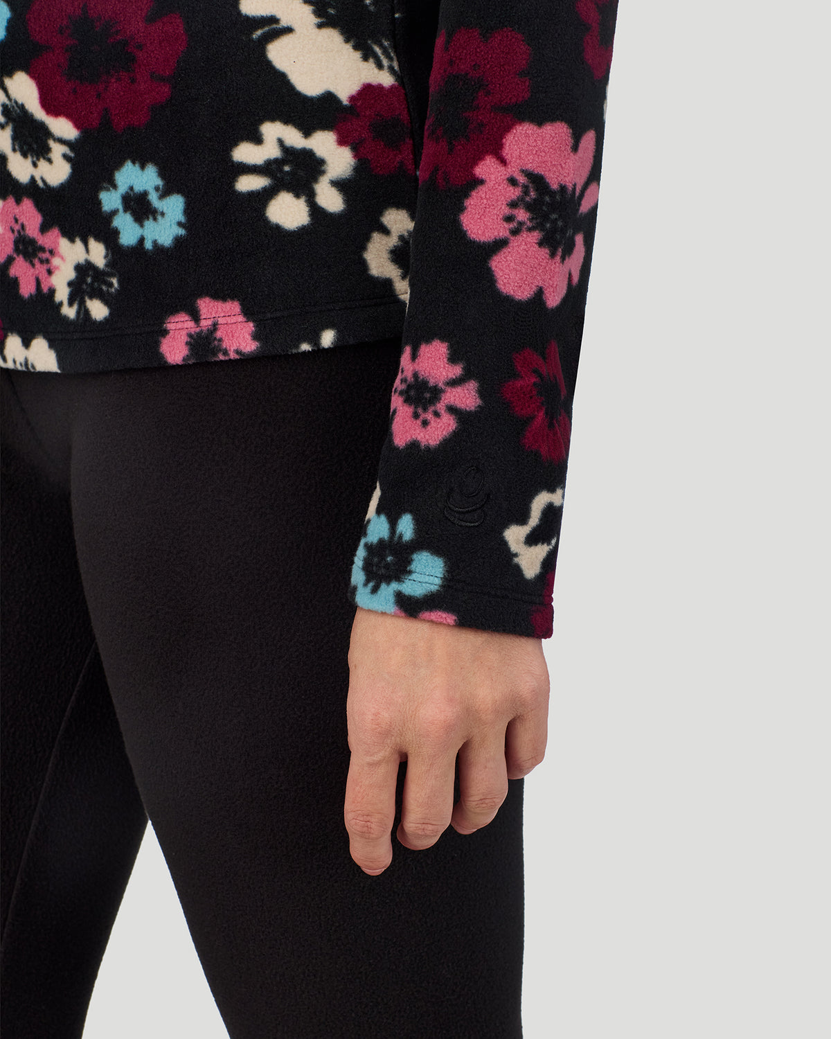 Black Oatmeal Floral; Model is wearing a size S. She is 5’9”, Bust 34.5”, Waist 25”, Hips 36.5”. @A lady wearing Black Oatmeal Floral Fleecewear with Stretch Long Sleeve Crew in a front view detail close up look