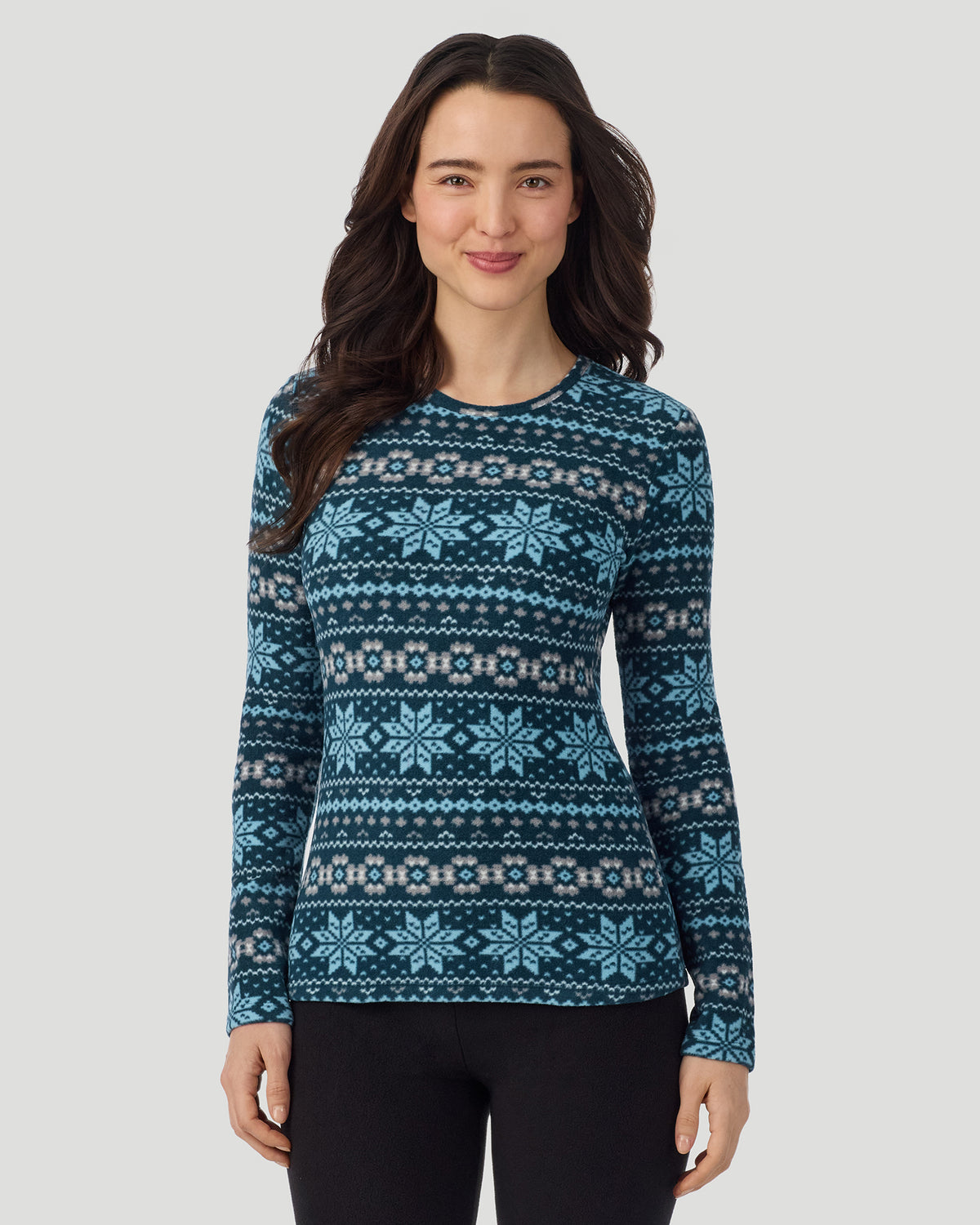 A lady wearing Emerald Fairisle Fleecewear with Stretch Long Sleeve Crew in a front view closer look