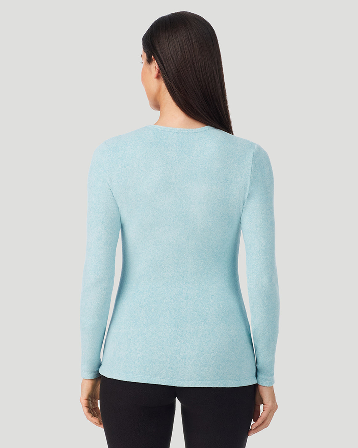 A lady wearing Cadet Blue Heather Fleecewear with Stretch Long Sleeve Crew in a back view closer look