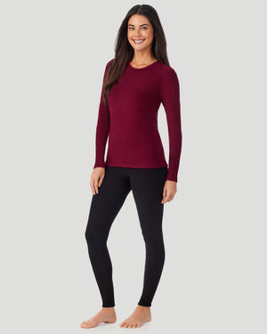 A lady wearing Bordeaux Fleecewear with Stretch Long Sleeve Crew in a front view standing pose