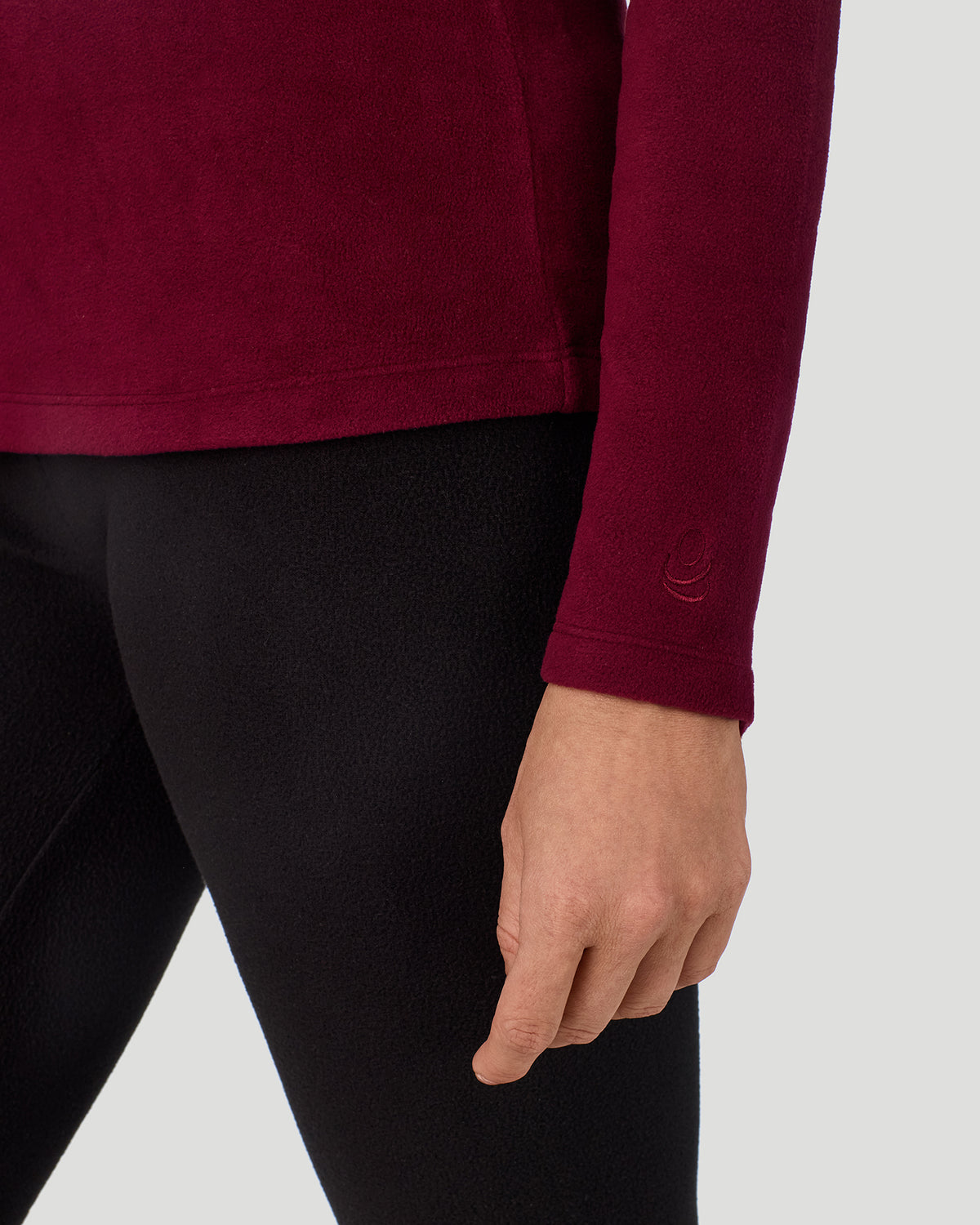 Bordeaux; Model is wearing a size S. She is 5’9”, Bust 34.5”, Waist 25”, Hips 36.5”. @A lady wearing Bordeaux Fleecewear with Stretch Long Sleeve Crew in a front view detail close up look