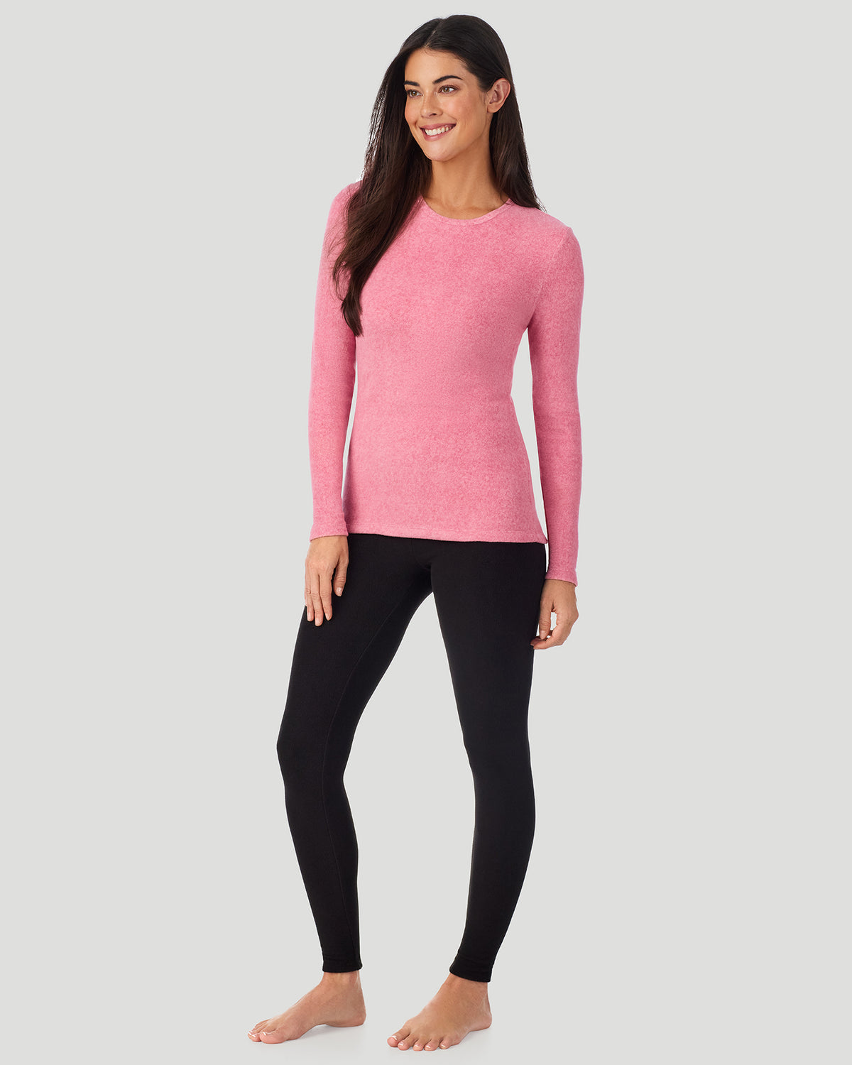 A lady wearing Red Suede Pink Heather Fleecewear with Stretch Long Sleeve Crew in a front view side angle pose