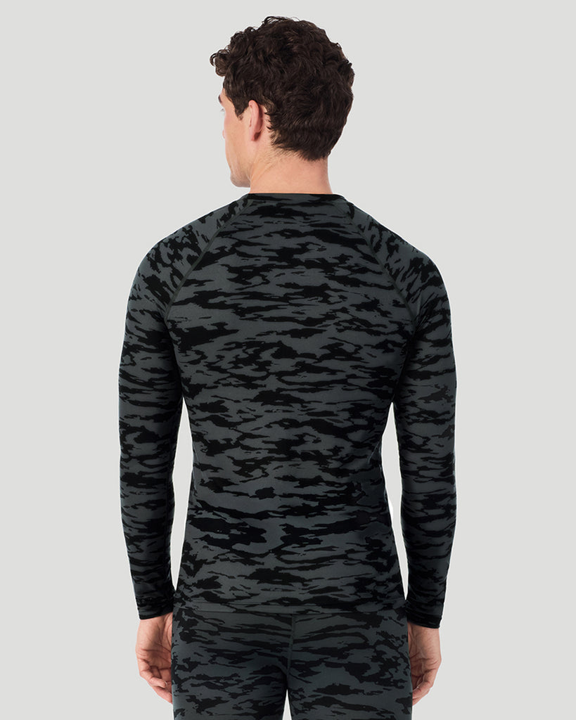 A man wearing Black Print ClimateSport Long Sleeve Crew in a back pose
