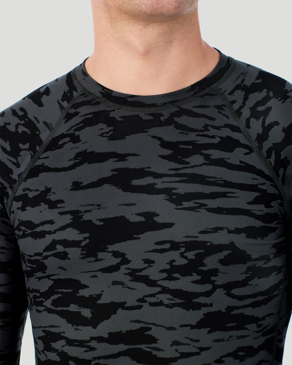 A man wearing Black Print ClimateSport Long Sleeve Crew in a front view close up look