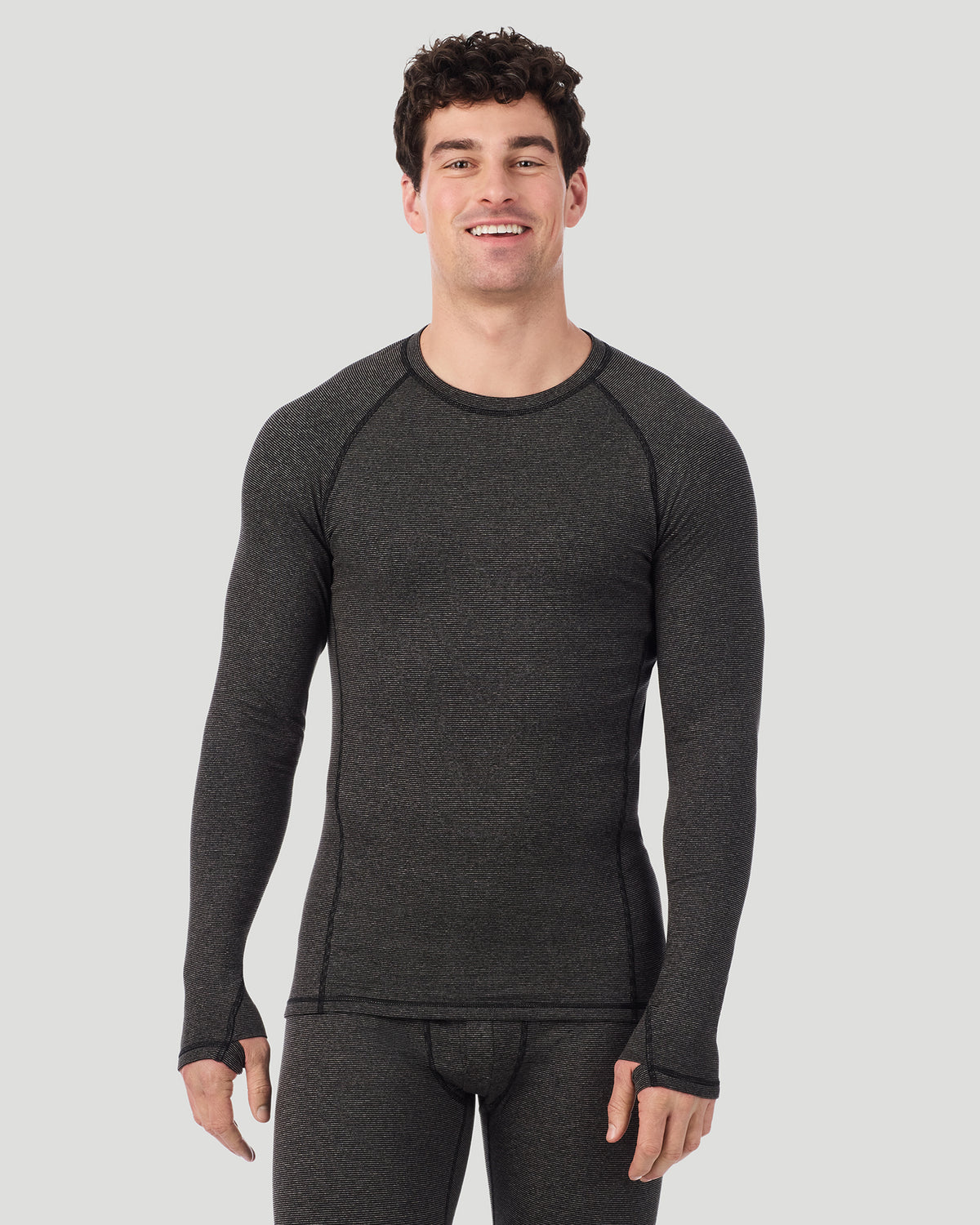  A man wearing Grey Stripe FlexStripe Long Sleeve Crew in a front view pose with a smile on his face