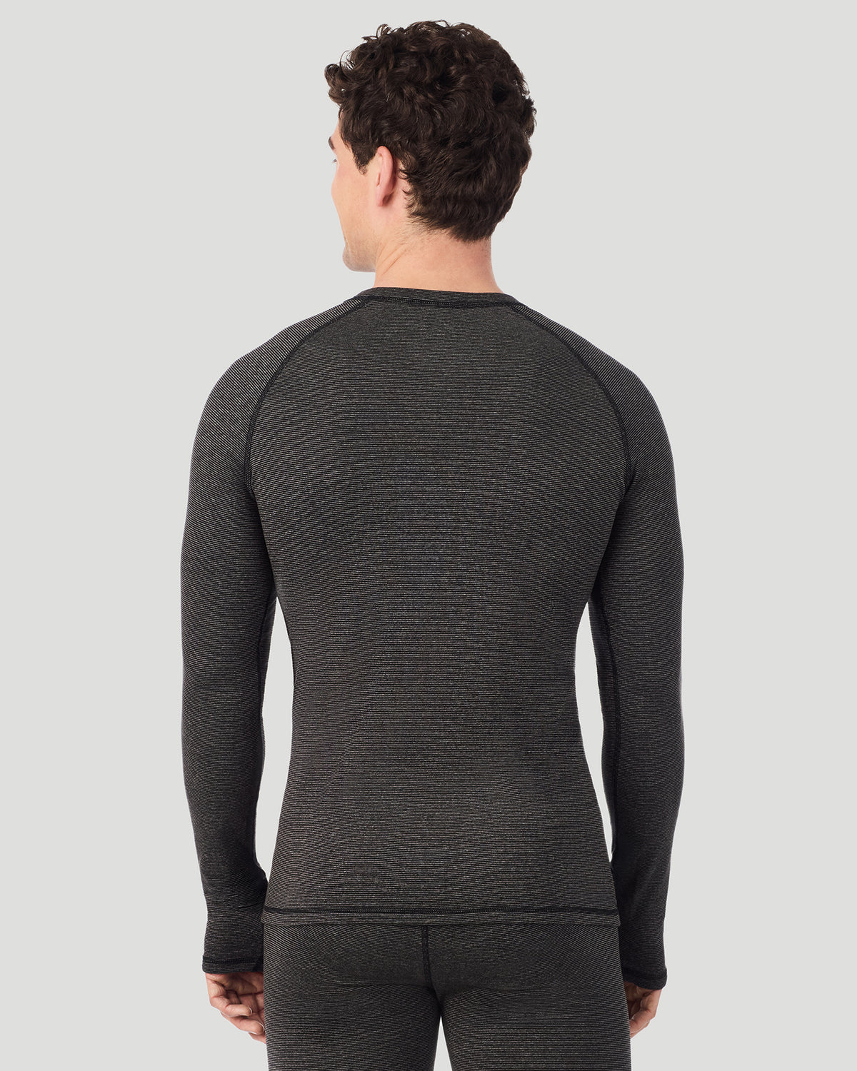  A man wearing Grey Stripe FlexStripe Long Sleeve Crew in a back view pose