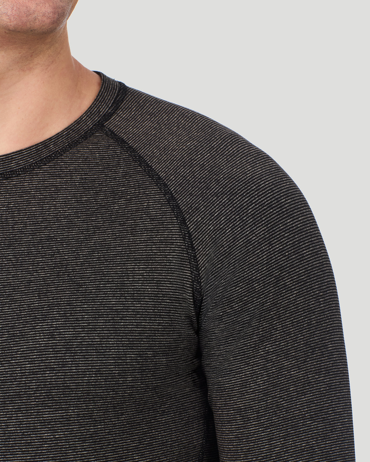  A man wearing Grey Stripe FlexStripe Long Sleeve Crew posing in a front view close up look of the shoulder area
